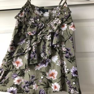 a green flowery spaghetti strap shirt